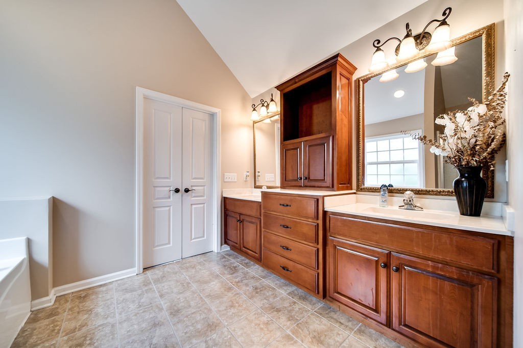 181 Dry Fork Road South Bethpage, TN 37022 - Photo 28 of 52 a spacious bathroom with a granite countertop sink mirror and a