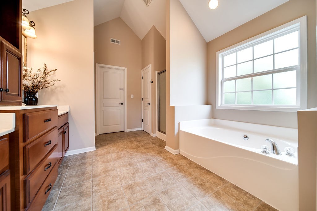 181 Dry Fork Road South Bethpage, TN 37022 - Photo 29 of 52 a spacious bathroom with a tub sink and mirror