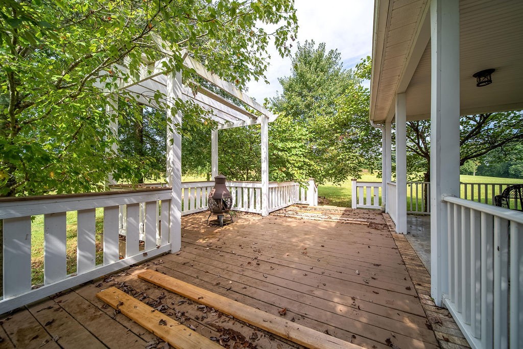 181 Dry Fork Road South Bethpage, TN 37022 - Photo 39 of 52 a view of a deck with wooden floor and fence