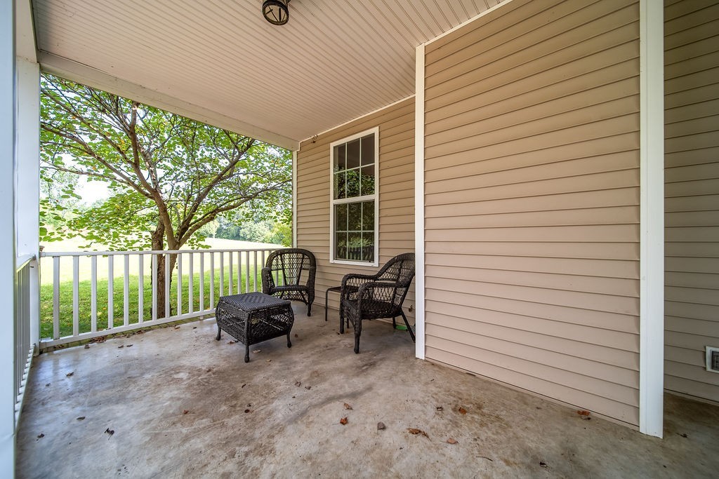 181 Dry Fork Road South Bethpage, TN 37022 - Photo 40 of 52 a balcony with furniture and a garden