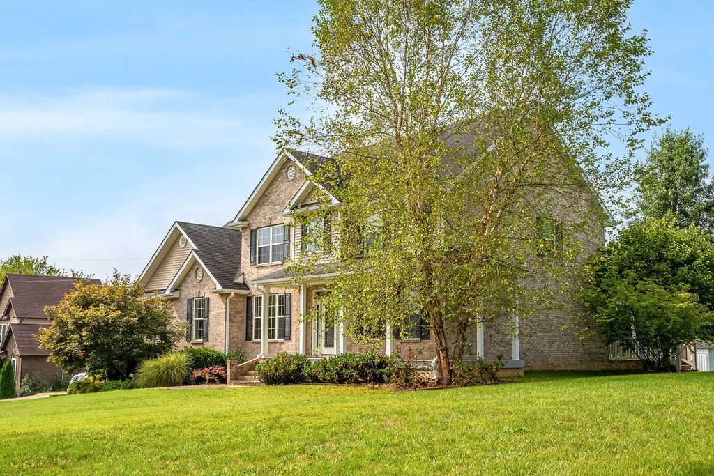 181 Dry Fork Road South Bethpage, TN 37022 - Photo 5 of 52 a front view of a house with garden