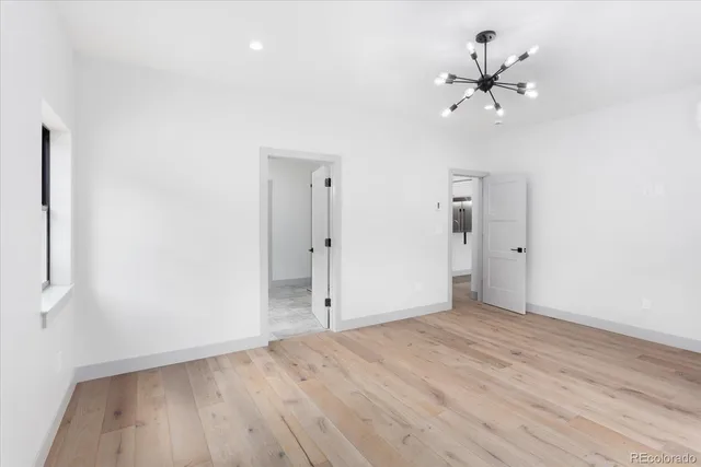 a bedroom with a large bed and a dresser