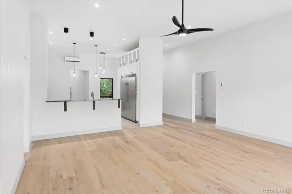 a kitchen with stainless steel appliances granite countertop a sink a oven a counter space and cabinets