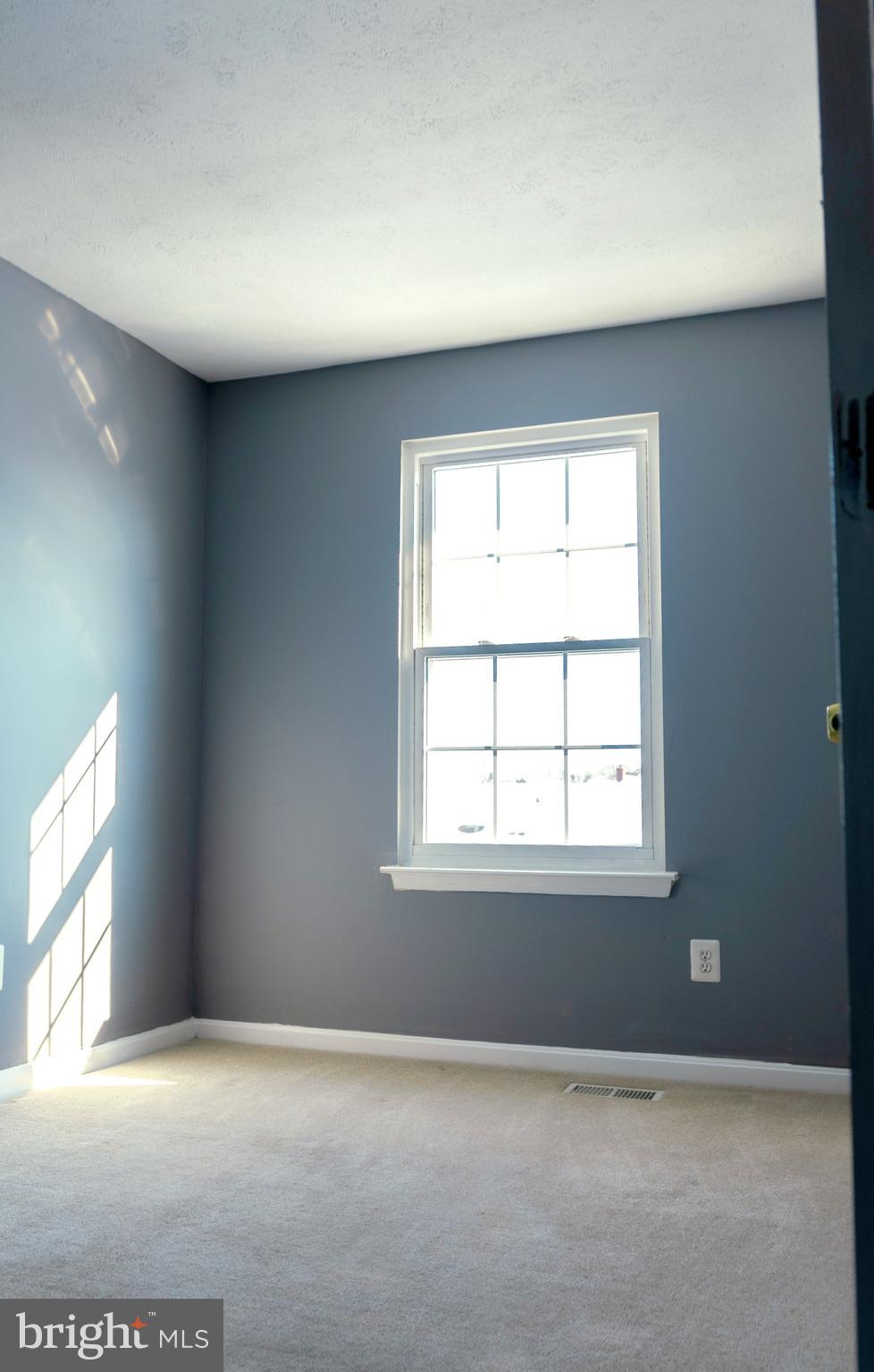 2323 Bluegrass Heights Court Rosedale, MD 21237 - Photo 11 of 14 an empty room with windows