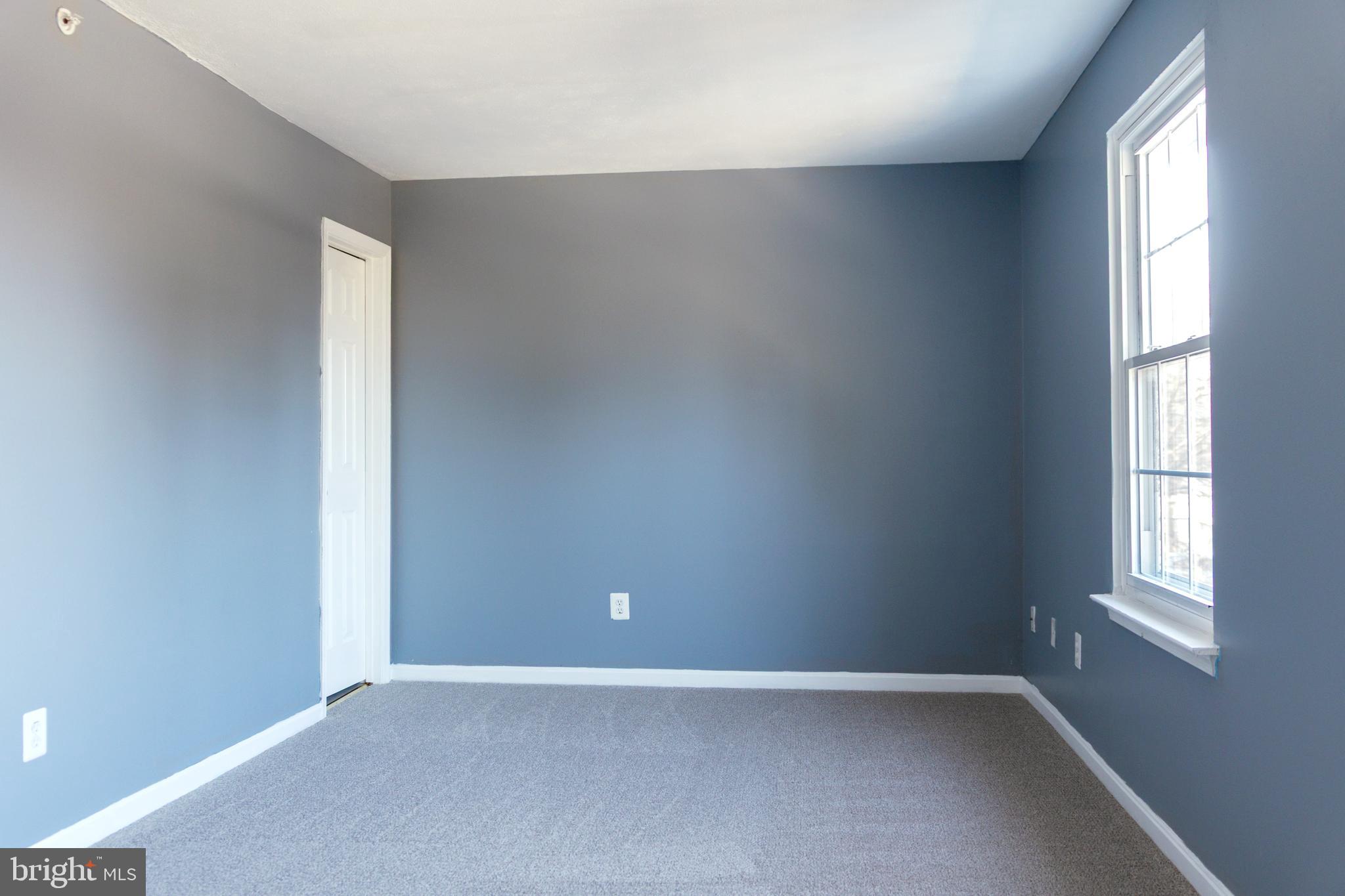 2323 Bluegrass Heights Court Rosedale, MD 21237 - Photo 12 of 14 an empty room with windows
