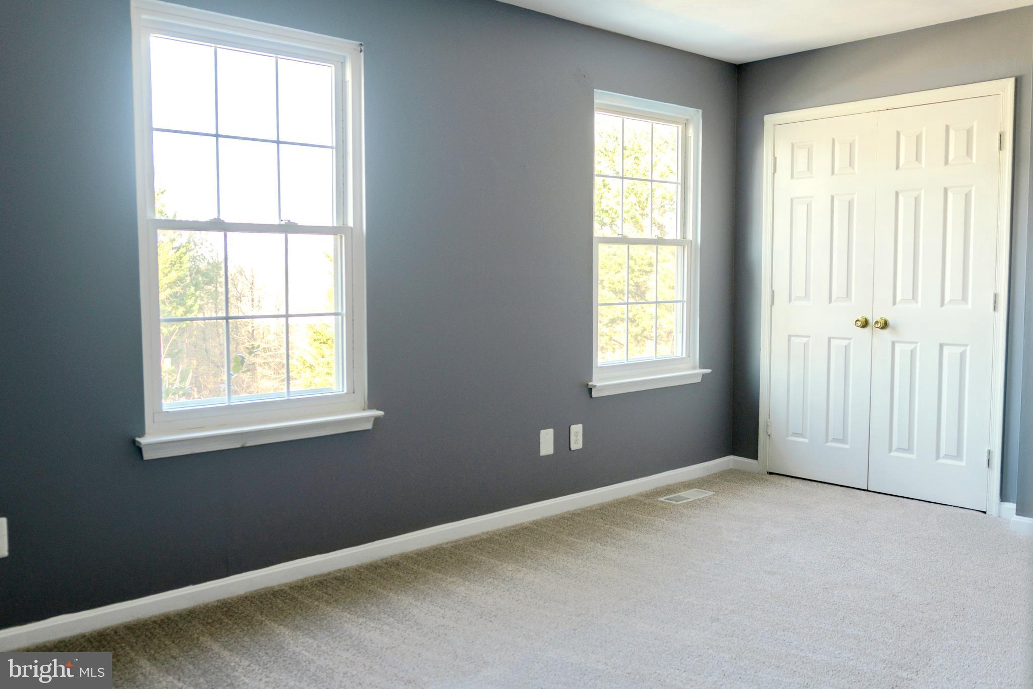 2323 Bluegrass Heights Court Rosedale, MD 21237 - Photo 13 of 14 an empty room with windows
