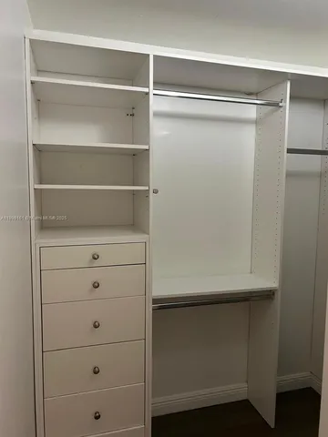 a view of an empty walk in closet