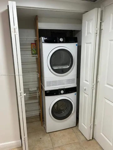 a bathroom with a sink a light fixture and a mirror