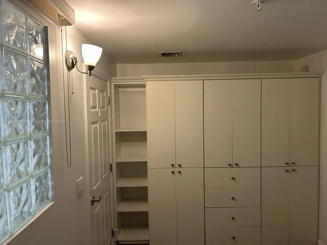 a view of a pathway with a yard