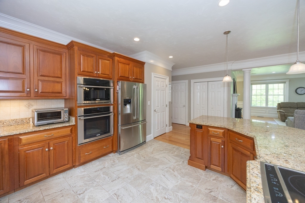 2 Powers Road Mendon, MA 01756 - Photo 12 of 40 a large kitchen with stainless steel appliances granite countertop a refrigerator and a sink
