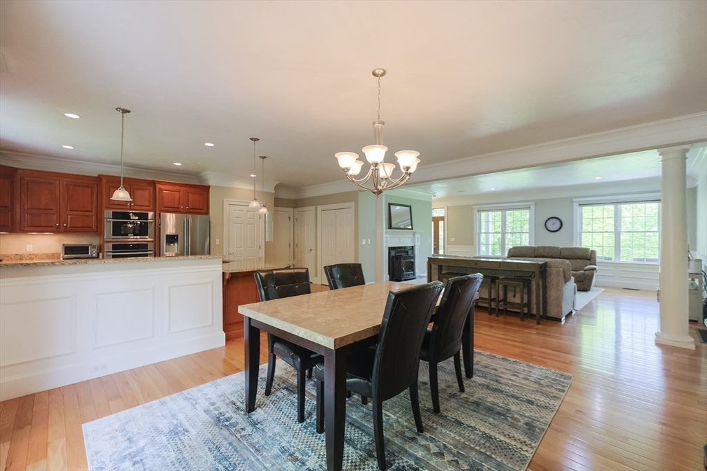 2 Powers Road Mendon, MA 01756 - Photo 15 of 40 a view of a dining room with furniture and wooden floor