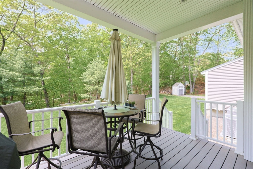 2 Powers Road Mendon, MA 01756 - Photo 16 of 40 a view of a dining room with furniture and wooden floor
