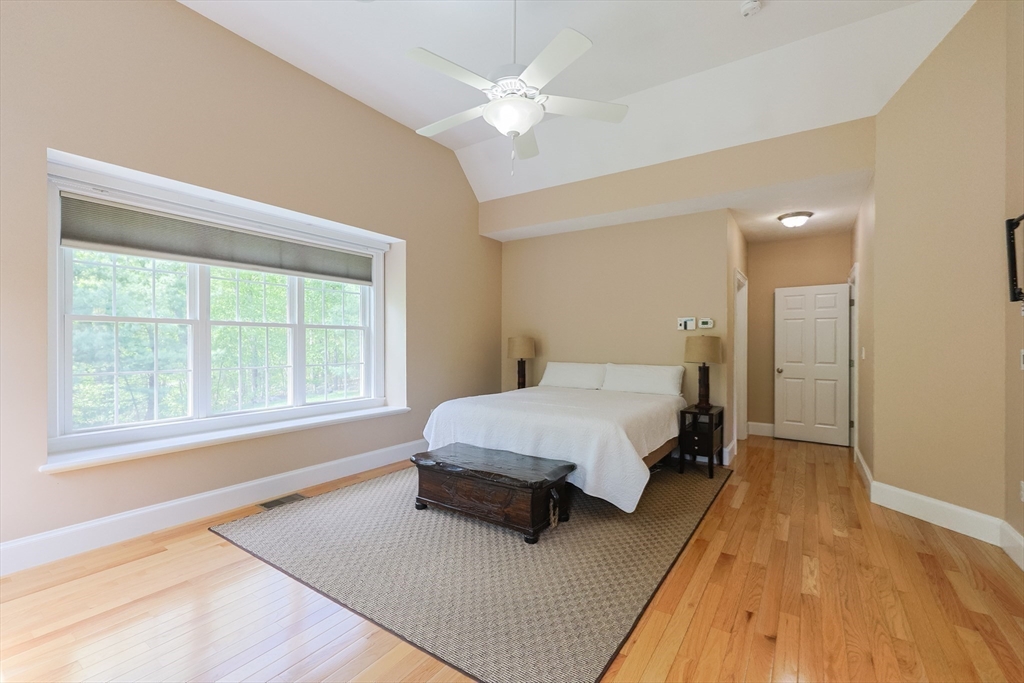 2 Powers Road Mendon, MA 01756 - Photo 18 of 40 a spacious bedroom with a bed and a window