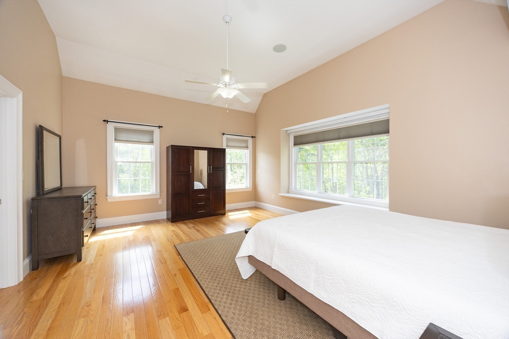 2 Powers Road Mendon, MA 01756 - Photo 19 of 40 a spacious bedroom with a bed and a television