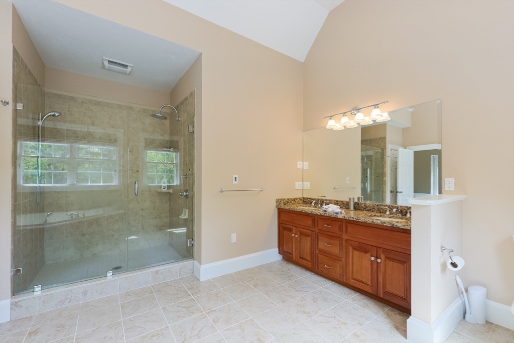 2 Powers Road Mendon, MA 01756 - Photo 20 of 40 a bathroom with a granite countertop sink mirror and shower