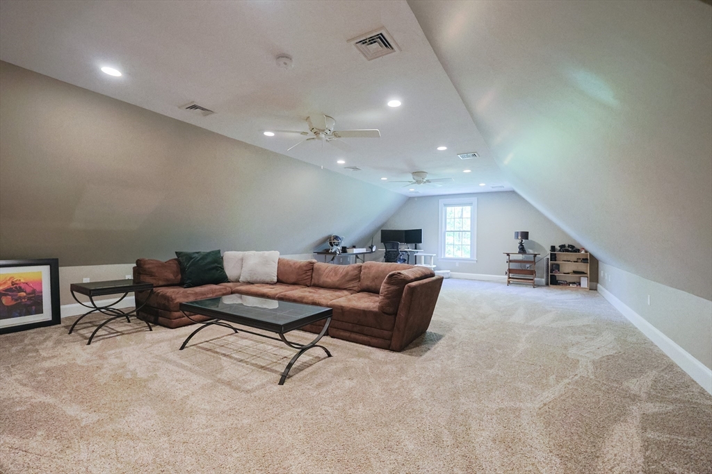2 Powers Road Mendon, MA 01756 - Photo 31 of 40 a living room with furniture and a potted plant