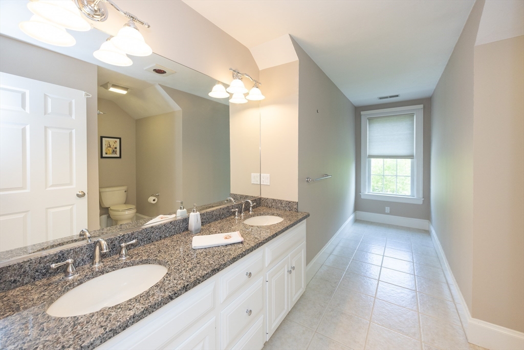 2 Powers Road Mendon, MA 01756 - Photo 34 of 40 a bathroom with a granite countertop double vanity sink and a mirror