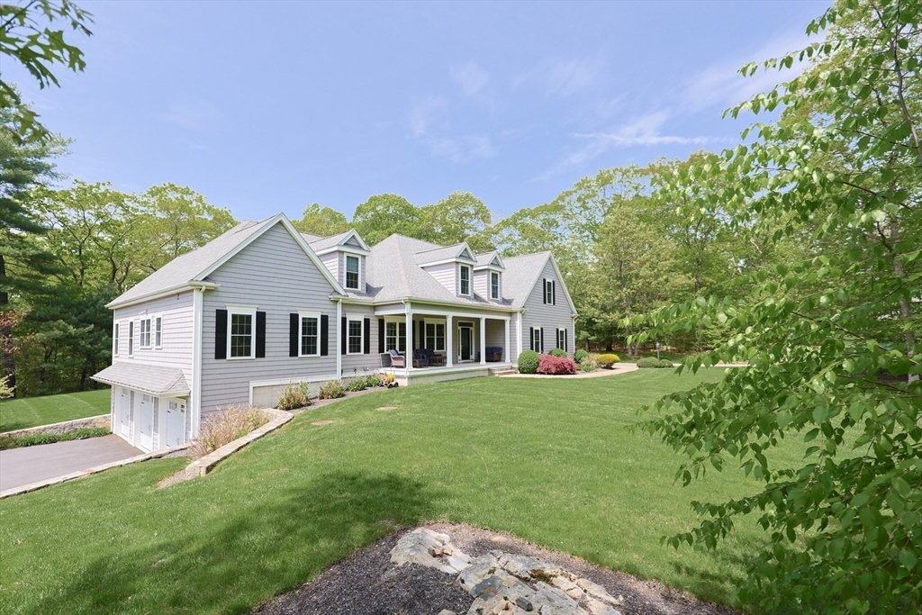 2 Powers Road Mendon, MA 01756 - Photo 4 of 40 a front view of a house with a garden