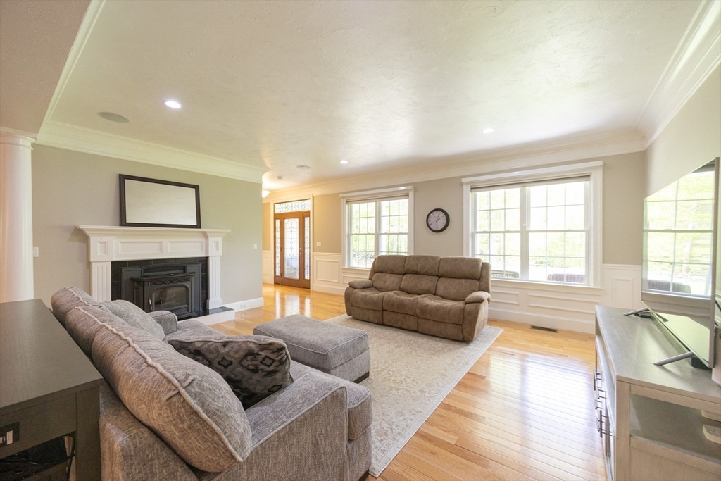 2 Powers Road Mendon, MA 01756 - Photo 8 of 40 a living room with furniture and a fireplace