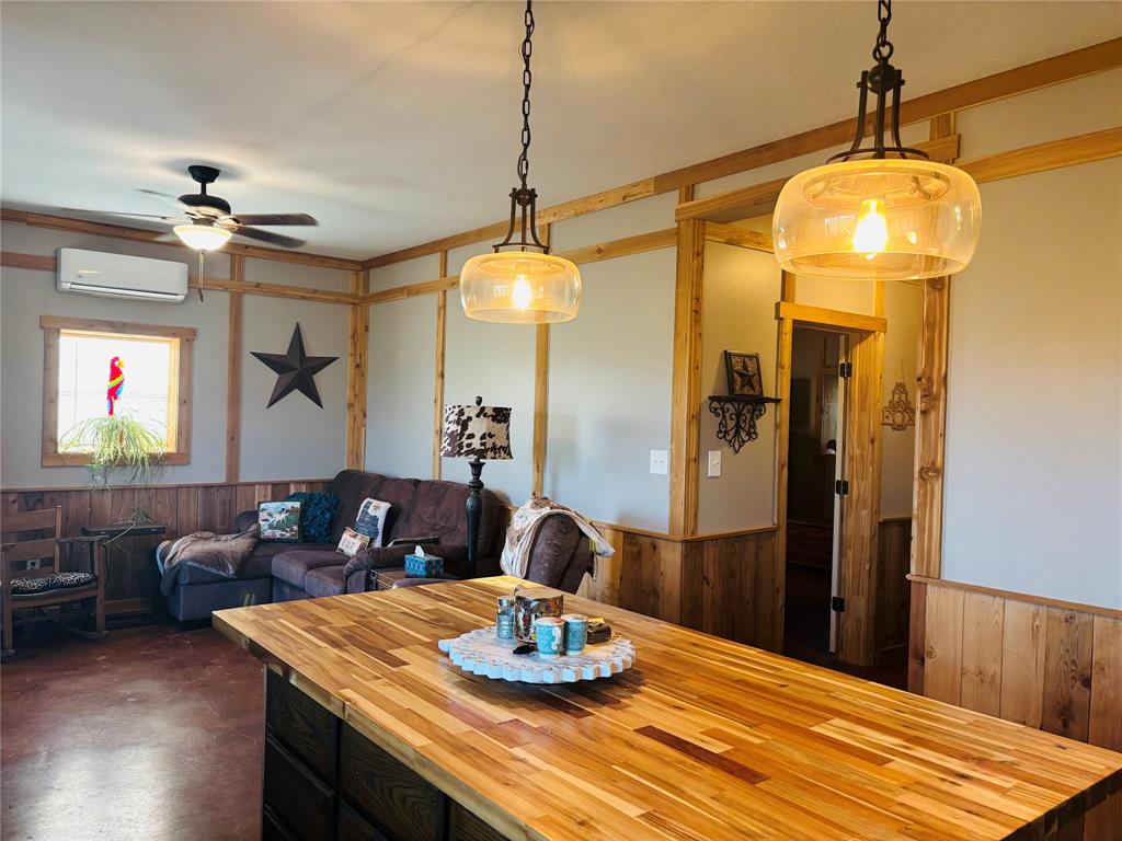 1883 Jc Maples Road Gunter, TX 75058 - Photo 11 of 12 a dining room with a table and chairs