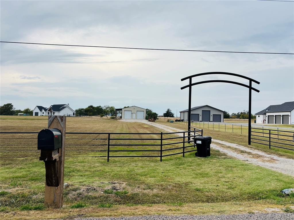 1883 Jc Maples Road Gunter, TX 75058 - Photo 2 of 12 a view of a swimming pool with a yard