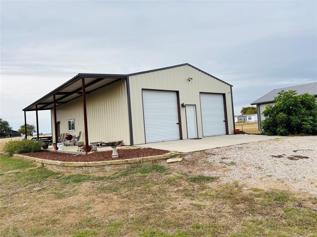 1883 Jc Maples Road Gunter, TX 75058 - Photo 9 of 12 a house with a outdoor space