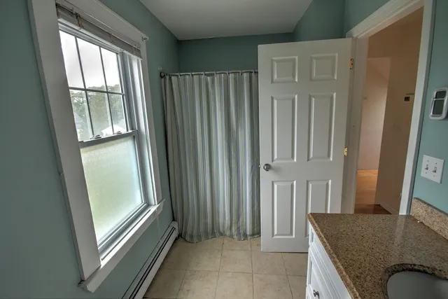 a white toilet sitting next to a bathroom sink
