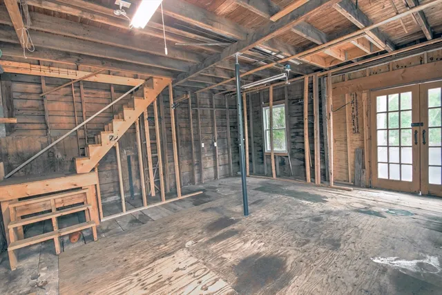 a view of a room with wooden walls