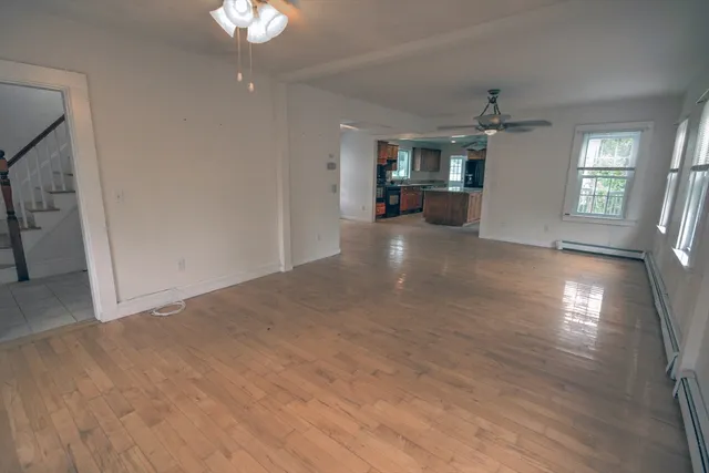 a view of livingroom with kitchen and window
