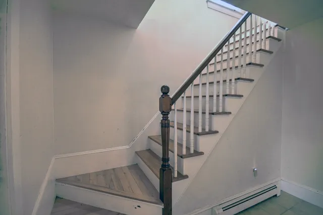 a view of entryway with wooden floor