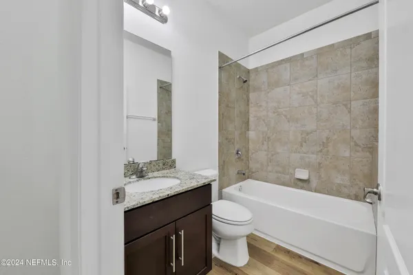 a picture on a wall with a white comforter