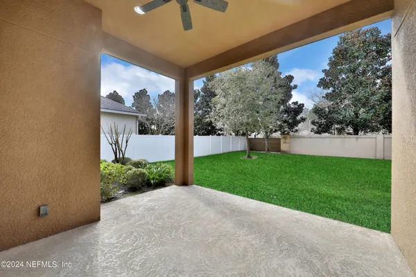 a view of a house with swimming pool and sitting area