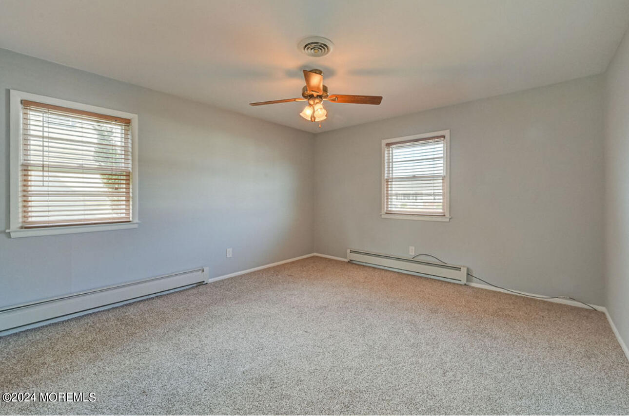 5 Coventry Road Toms River, NJ 08757 - Photo 21 of 27 a view of an empty room with a window