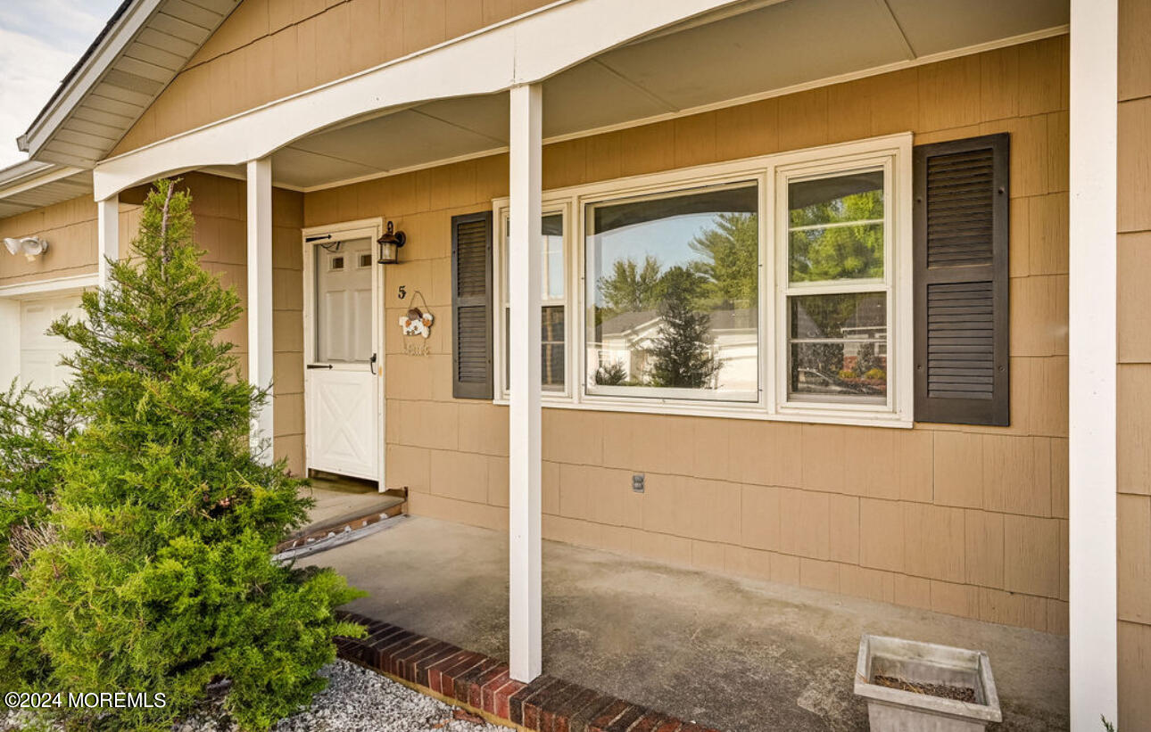 5 Coventry Road Toms River, NJ 08757 - Photo 4 of 27 a front view of a house with a yard