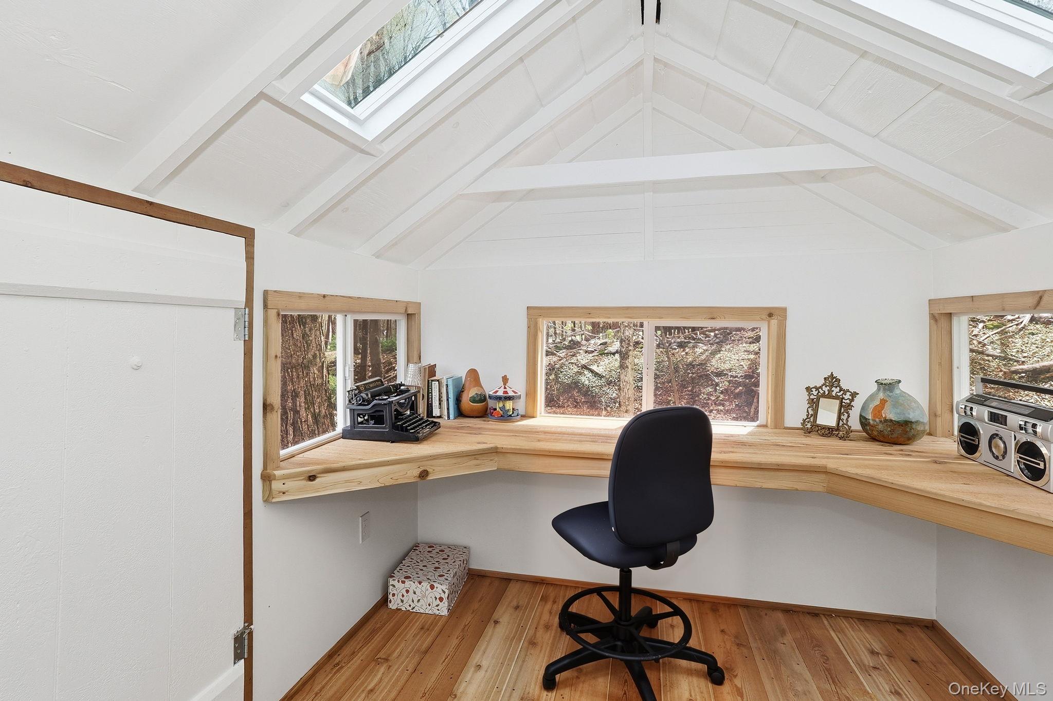 1141 Beekman Road Hopewell Junction, NY 12533 - Photo 30 of 36 a view of a workspace with furniture and a window