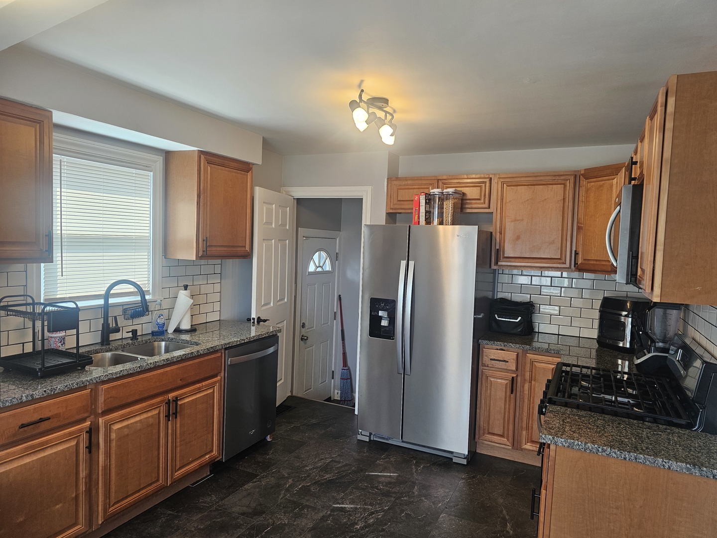 2320 South 9th Avenue Broadview, IL 60155 - Photo 5 of 10 a kitchen with stainless steel appliances granite countertop a refrigerator stove and sink