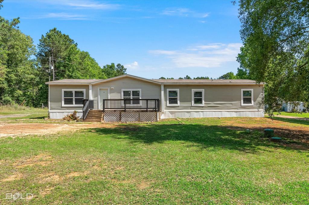 2153 Highway 2 Plain Dealing, LA 71064 - Photo 4 of 39 a front view of a house with swimming pool having outdoor seating