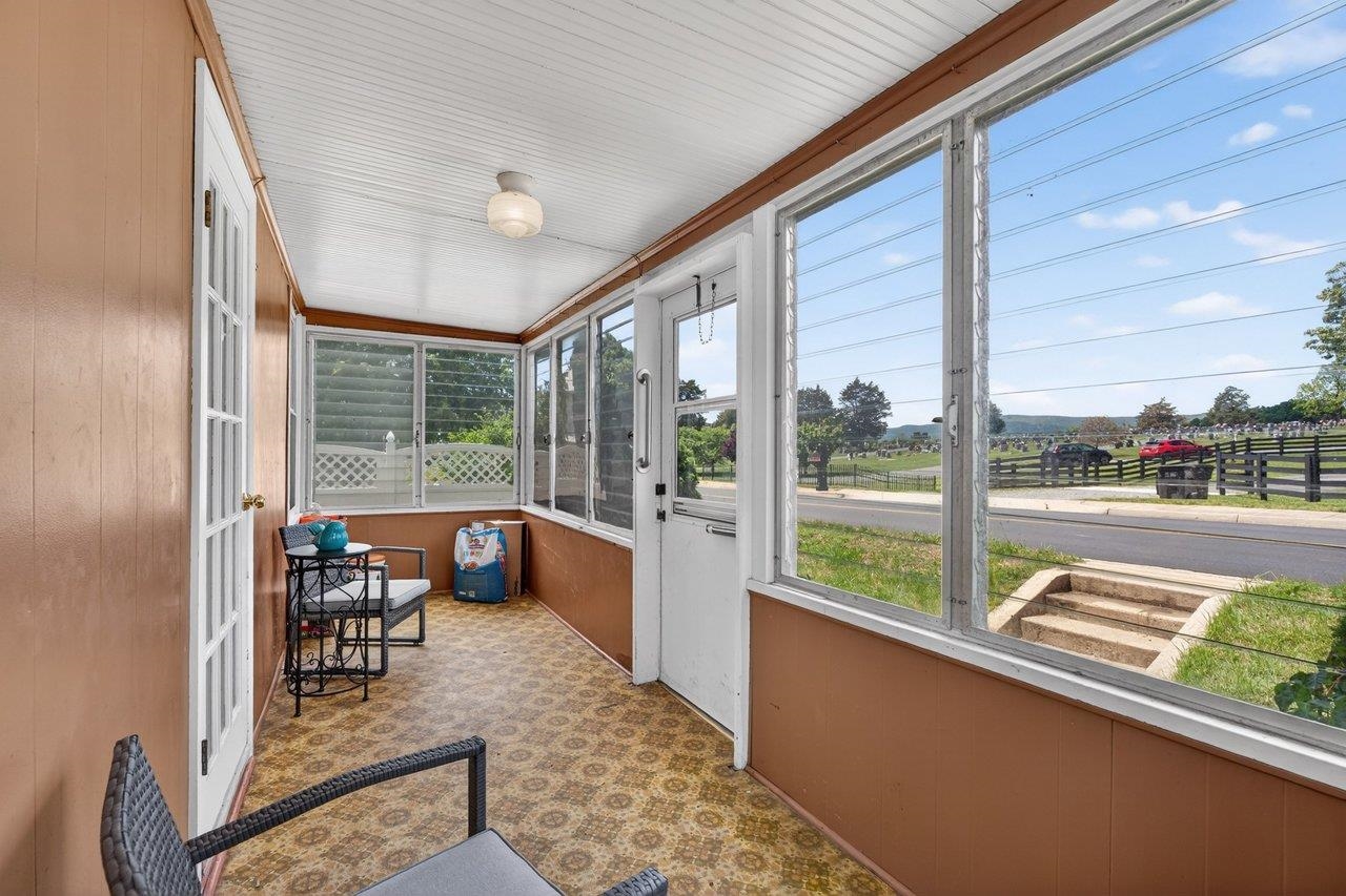 724 Newtown Road Elkton, VA 22827 - Photo 5 of 38 a floor to ceiling window with wooden floor