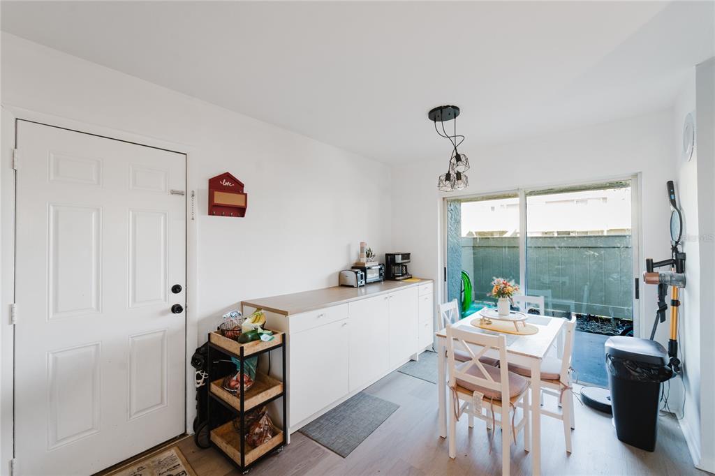4413 Ring Neck Road, Unit 4413 Orlando, FL 32808 - Photo 17 of 24 a dining room with furniture and a window