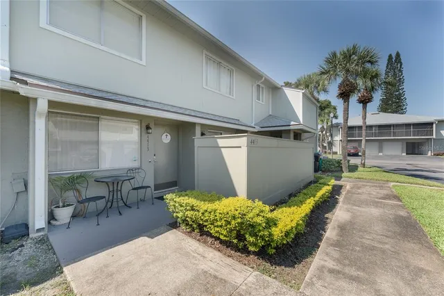 a swimming pool with outdoor seating and yard