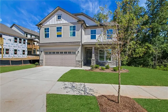 a front view of a house with a yard