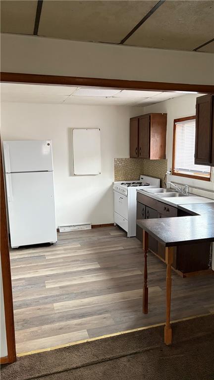 250 Virginia Avenue, Unit 3 Rochester, PA 15074 - Photo 4 of 10 a view of kitchen with cabinets and wooden floor