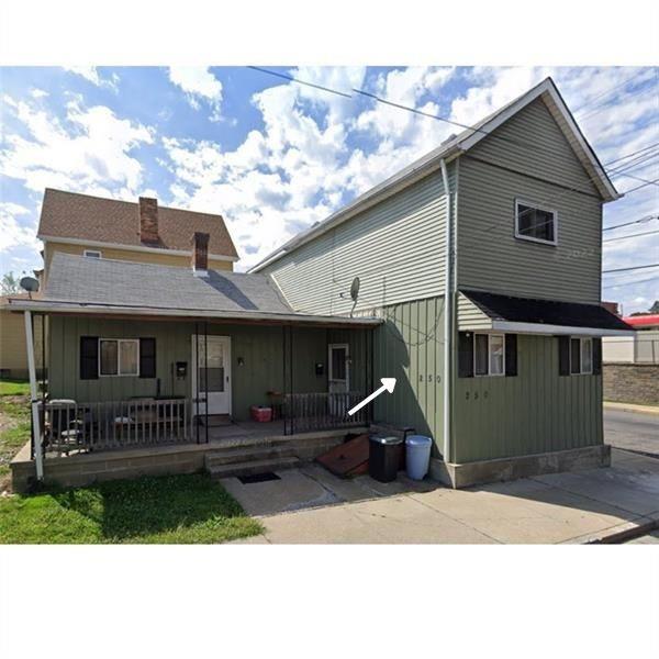 250 Virginia Avenue, Unit 3 Rochester, PA 15074 - Photo 10 of 10 a front view of a house with a yard
