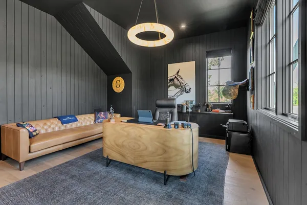 a bathroom with a double vanity sink a mirror and a bathtub