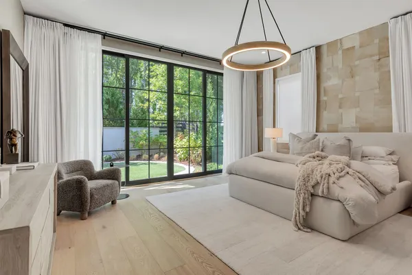 a living room with a bed furniture and a window