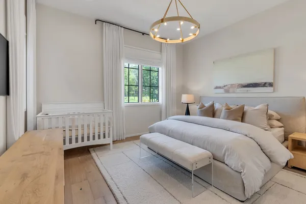 an aerial view of a house with a garden and lake view