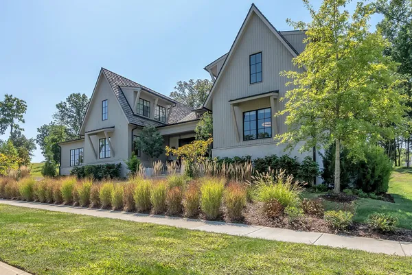 a living room with couches and a flat screen tv