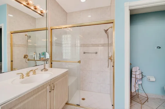 a bathroom with a tub a sink and a shower