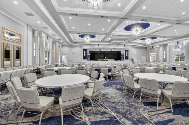 a dining room with lots of tables and chairs