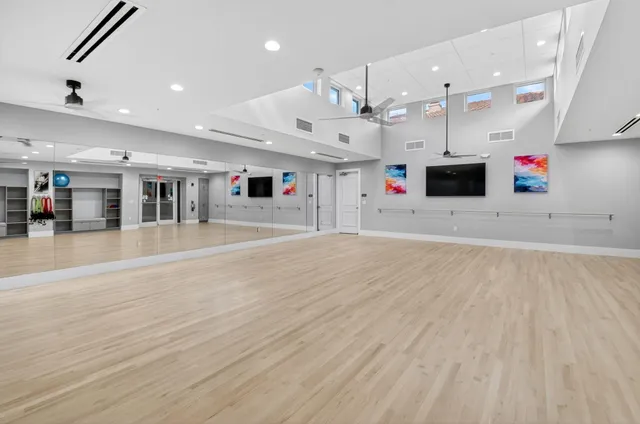 a living room with furniture a rug and a chandelier